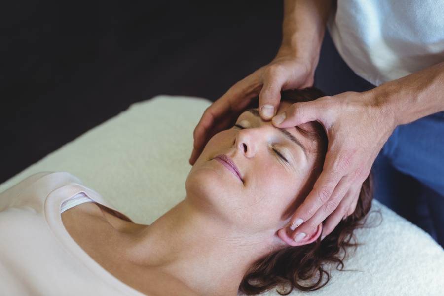Women getting massage for headache.